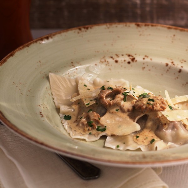 Veal Raviolis With A Morel Cream Sauce And Shaved Parmigiano Reggiano